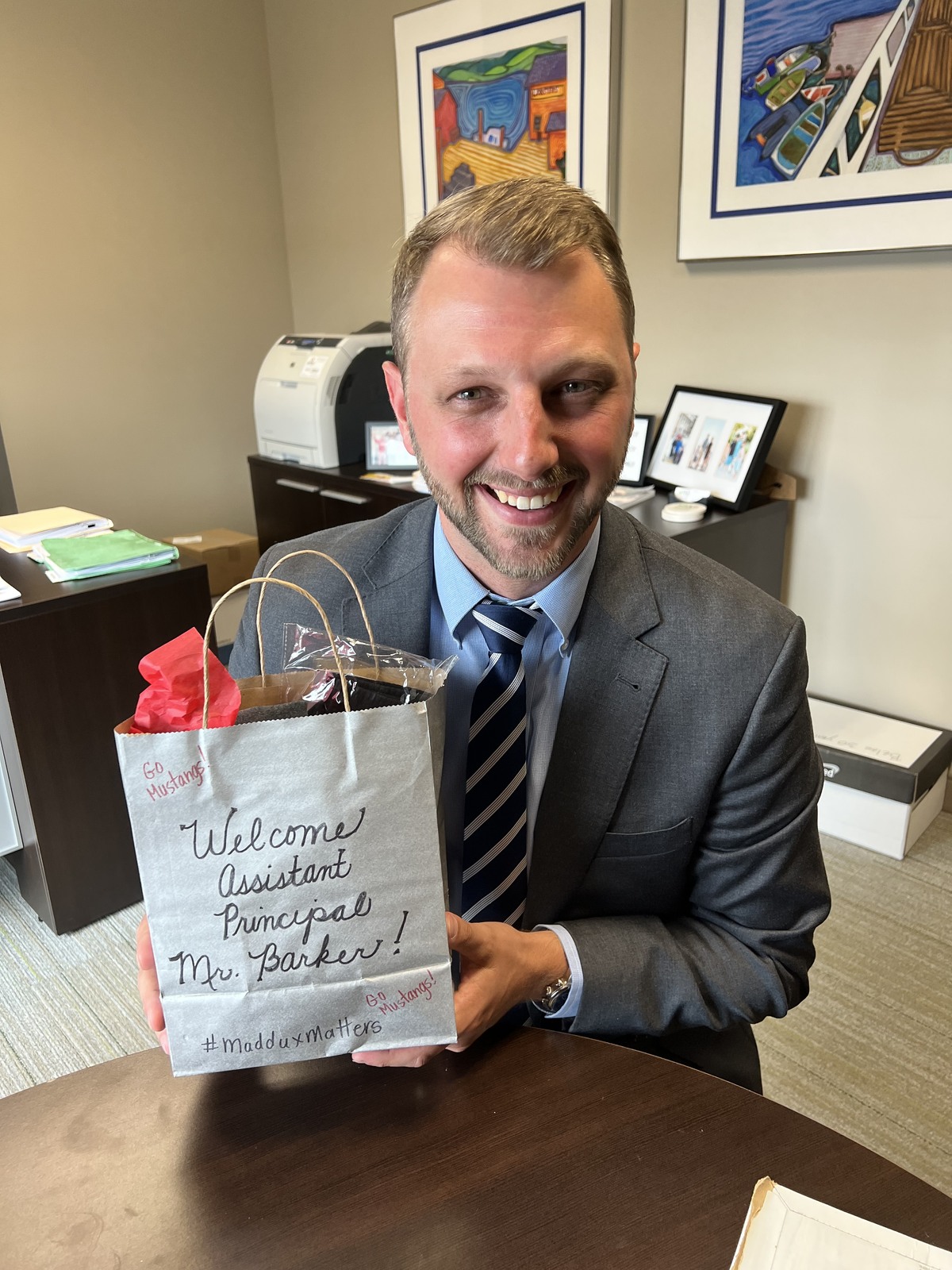 Chris Barker holds a welcome gift at Maddux
